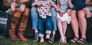 mothers wearing boots and sandals with children